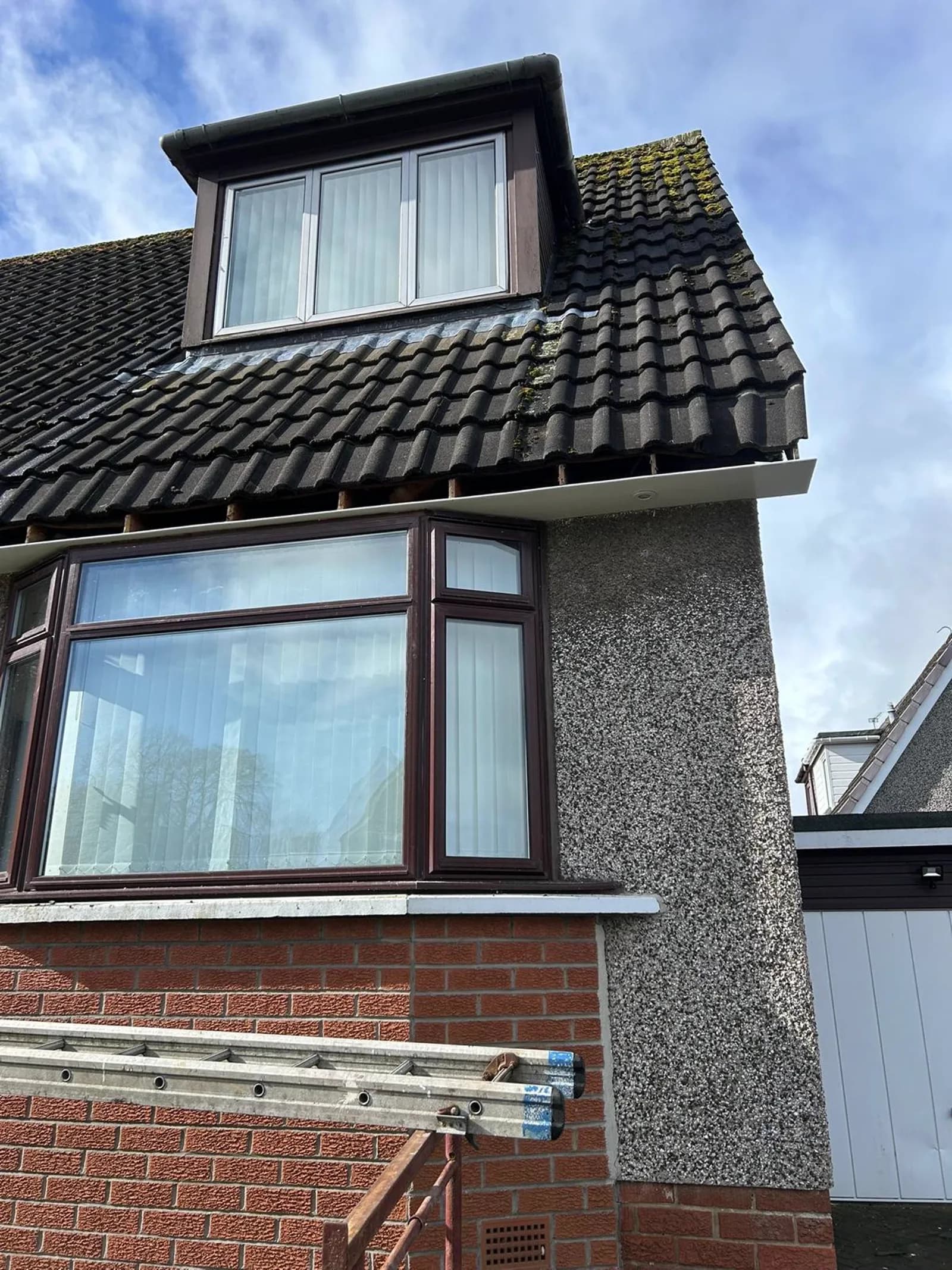 UPVC fascia board fitted along a roofline during a re-roof